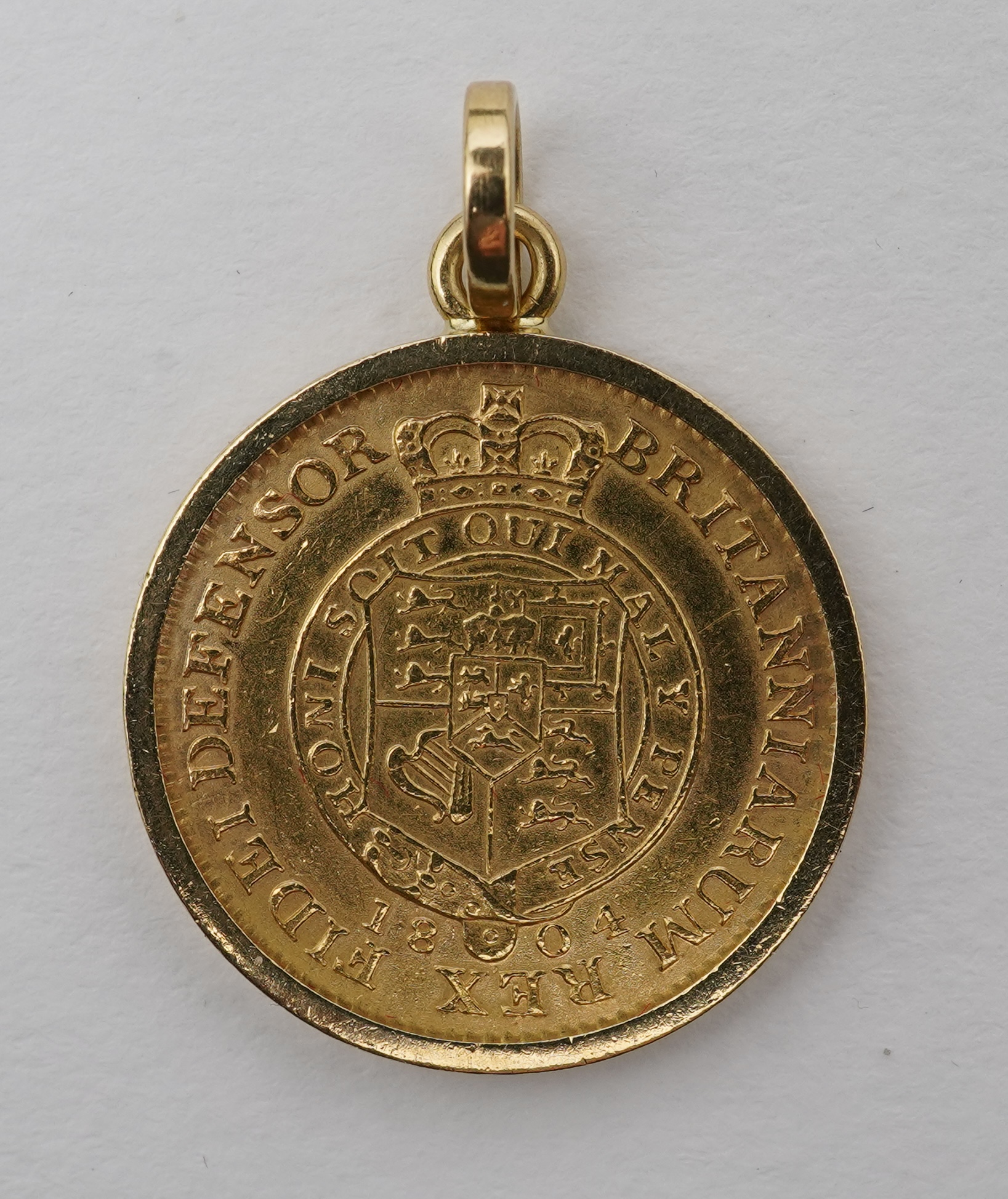 A George III half guinea pendant, circa 1804 and later